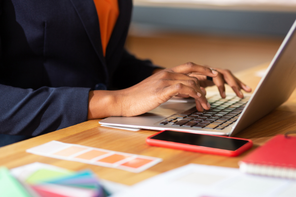 Woman creating design on a laptop